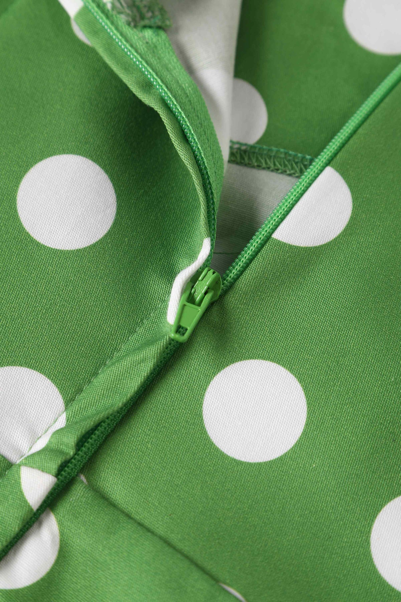 Close up view of Crossover Bust Green White Polka Dot Dress