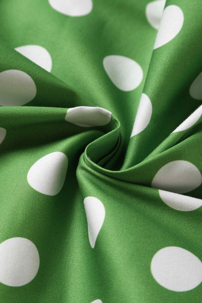 green fabric, with white polka dot spots