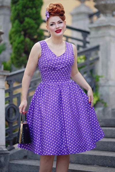 A model wearing a Crossover Bust Purple White Polka Dot Dress