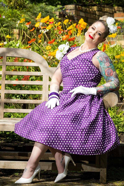 A model wearing Crossover Bust Purple White Polka Dot Dress