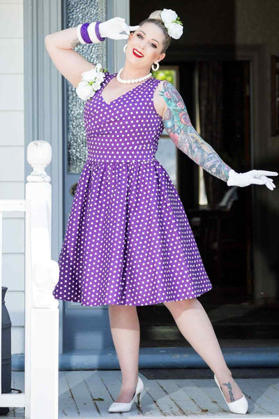 A model wearing Crossover Bust Purple White Polka Dot Dress