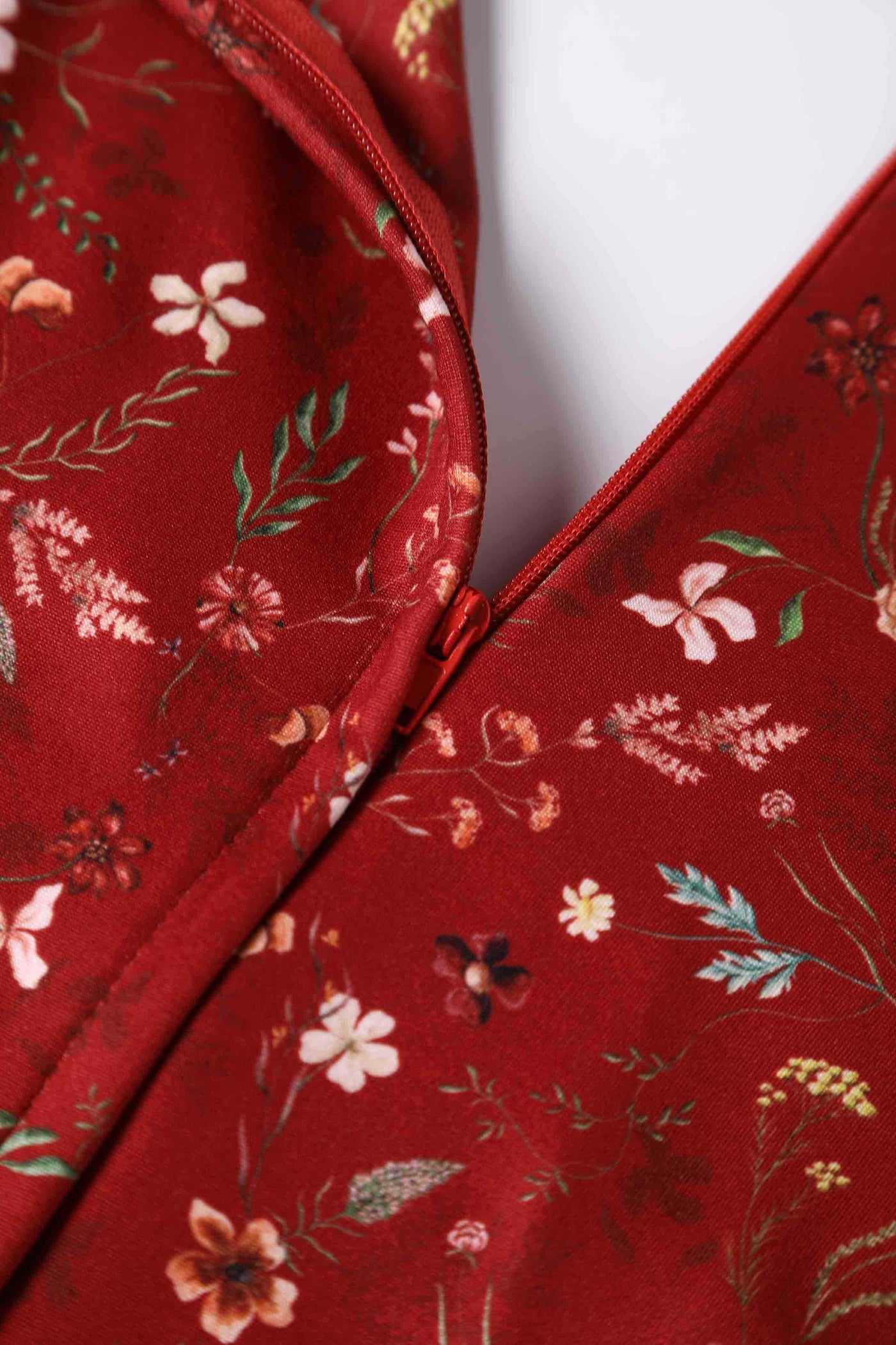 Close up view of Dainty Floral Tea Dress in Burgundy