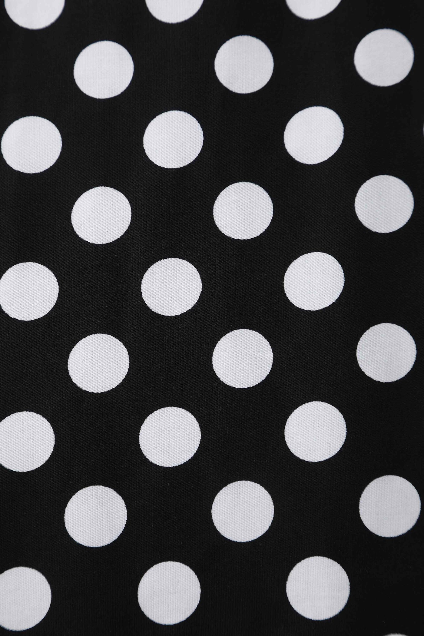 Close up view of Daisy Black Polka Dot Halter Dress