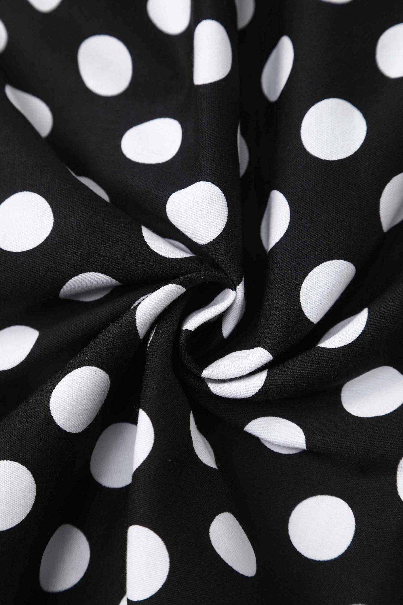 Close up view of Daisy Black Polka Dot Halter Dress