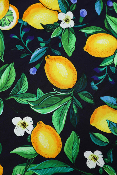 Close up view of Daisy Lemon Halter Dress In Black