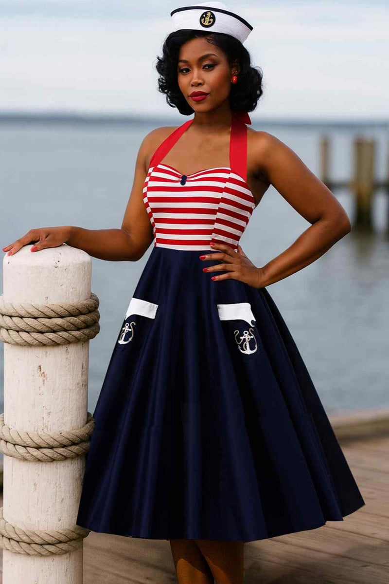 A model wearing a Daisy Nautical Striped Halter Dress With Anchor Embroidery
