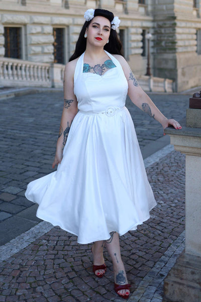 A model wearing a Daisy White Satin Halter Dress