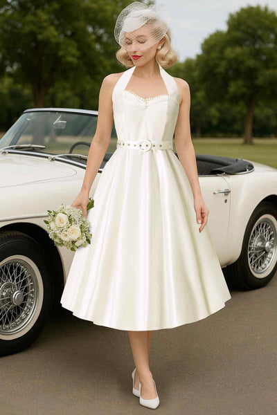 A model wearing Daisy White Satin Halter Dress