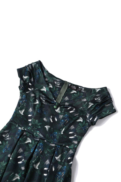 Close up view of Dark Green Off Shoulder Dress In Magpie Print