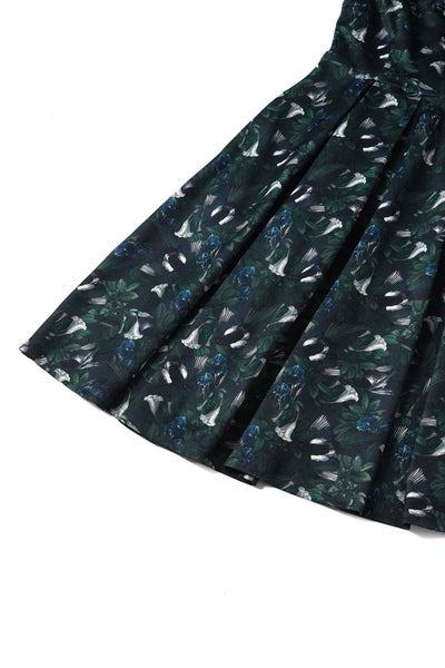 Close up view of Dark Green Off Shoulder Dress In Magpie Print