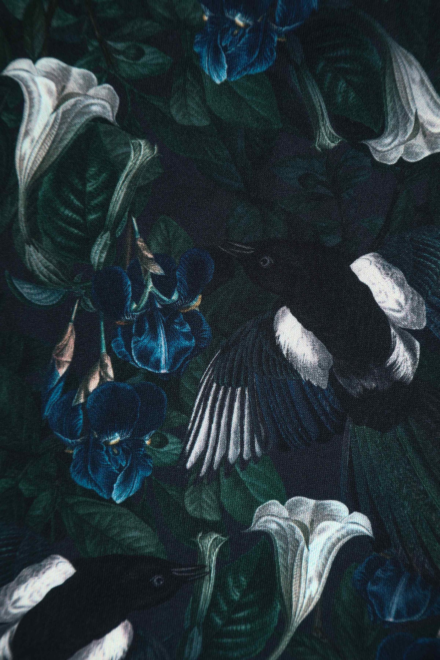 Close up view of Dark Green Off Shoulder Dress In Magpie Print