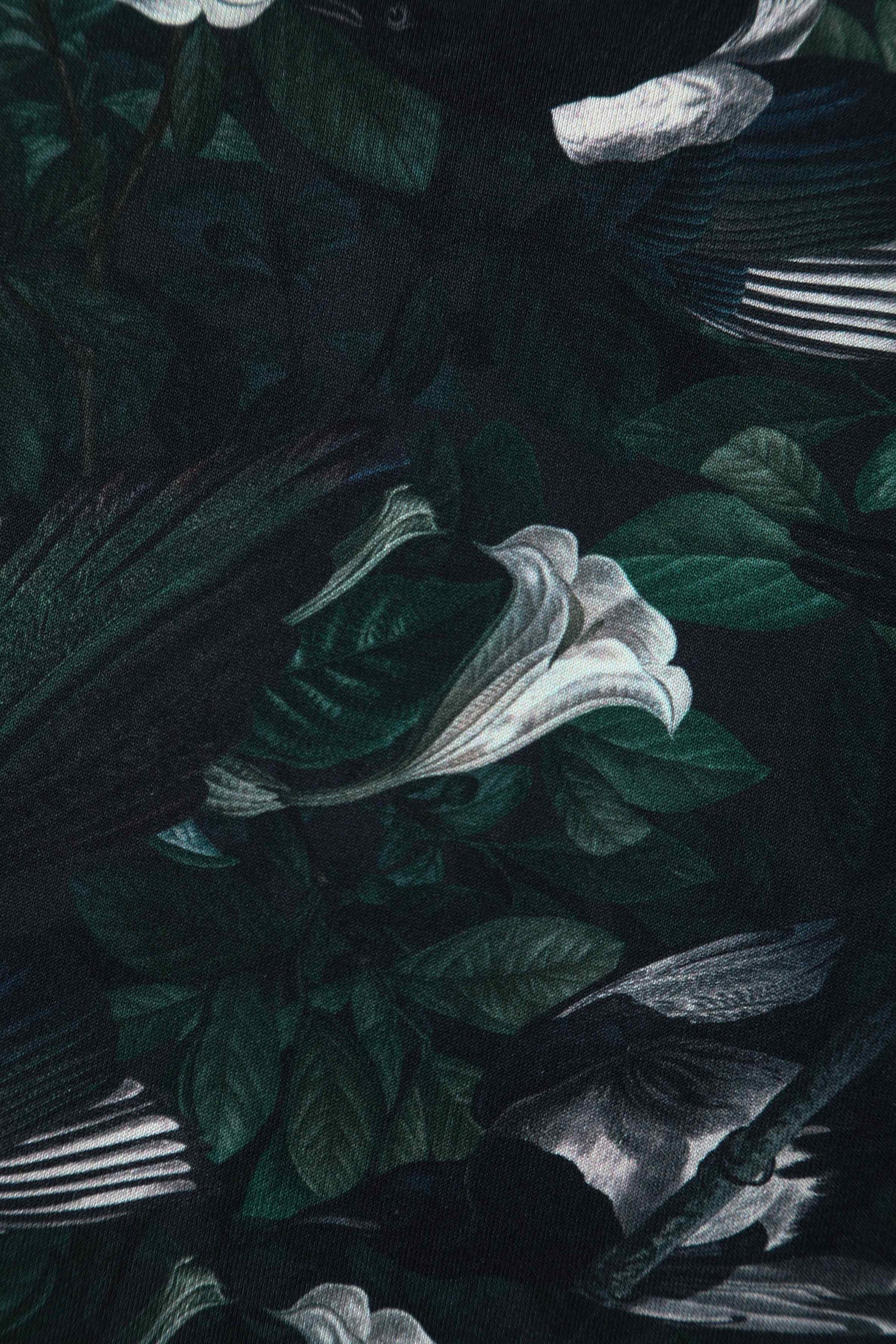 Close up view of Dark Green Off Shoulder Dress In Magpie Print