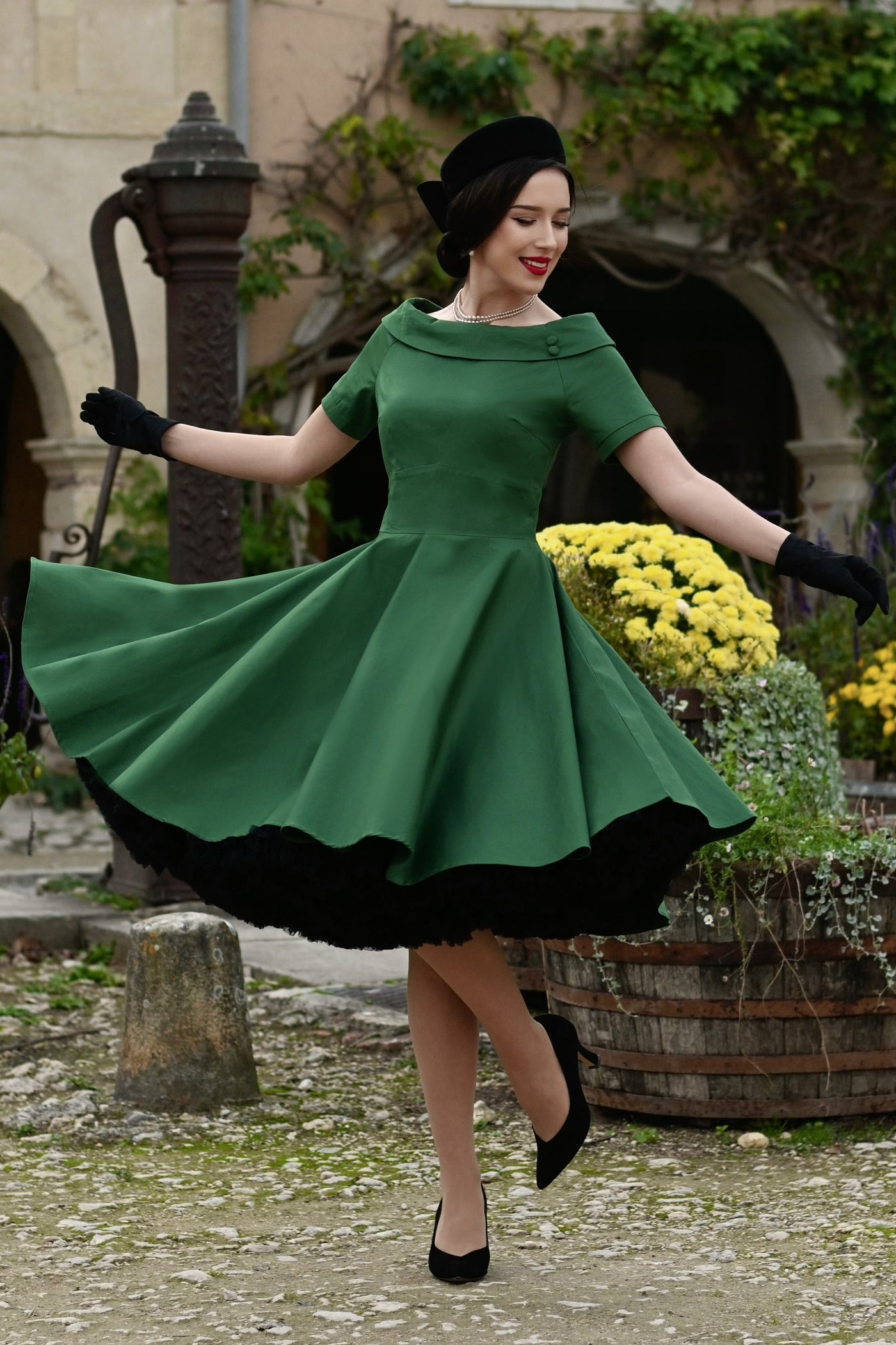 A lady wearing a Darlene Green Roll Collar Circle Dress