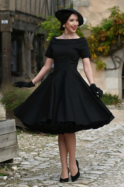A charming model wearing a Darlene Little Black Dress