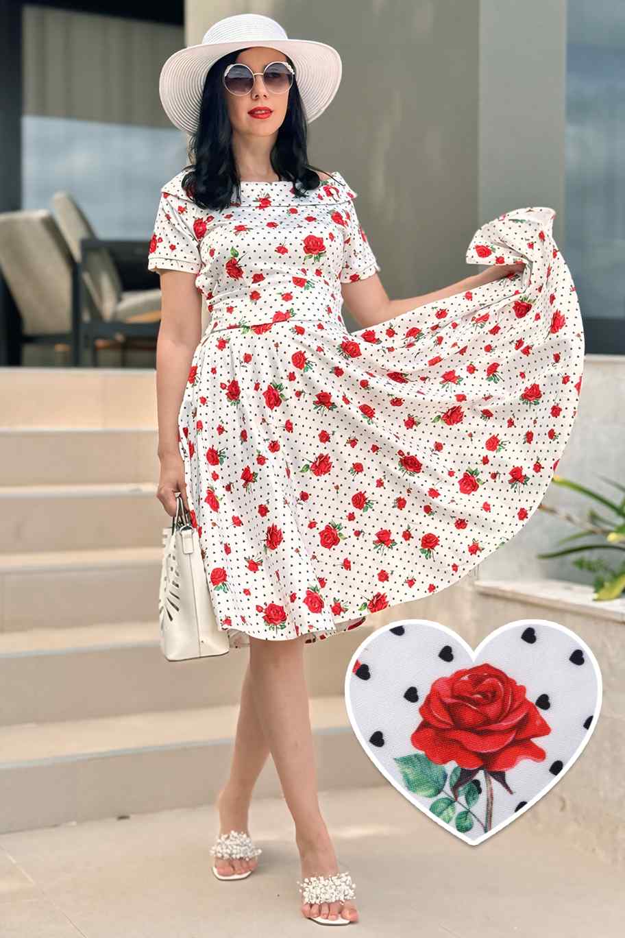 A lady wearing a Retro Heart & Rose Dress