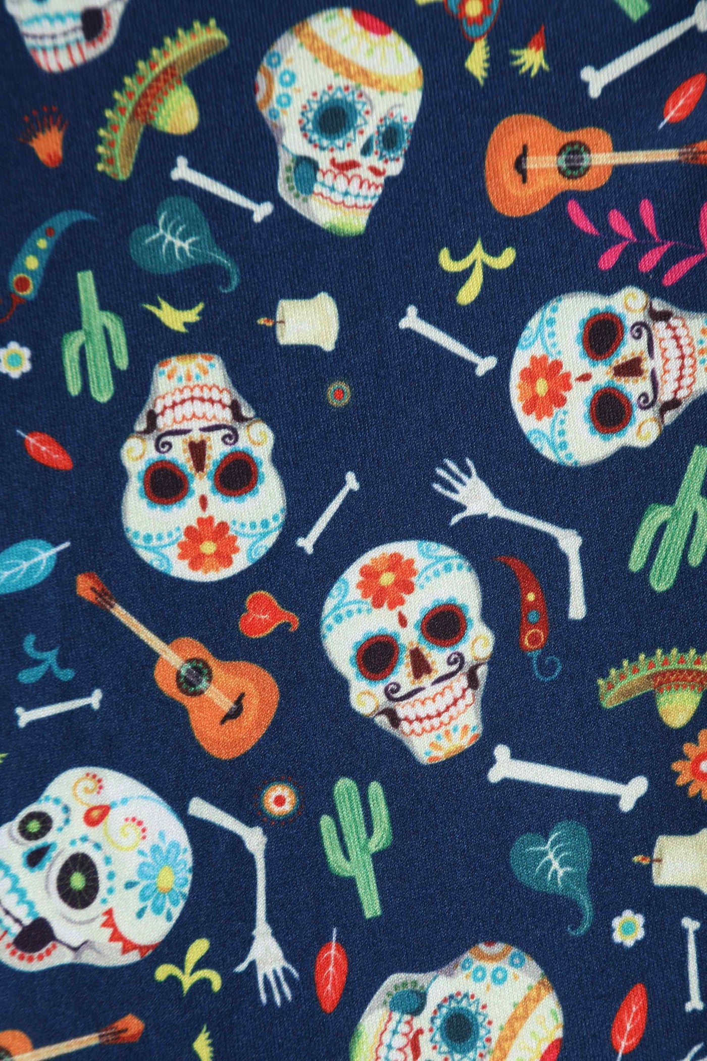 Close up View of Day of the Dead Sugar Skulls Print Dress in Navy Blue