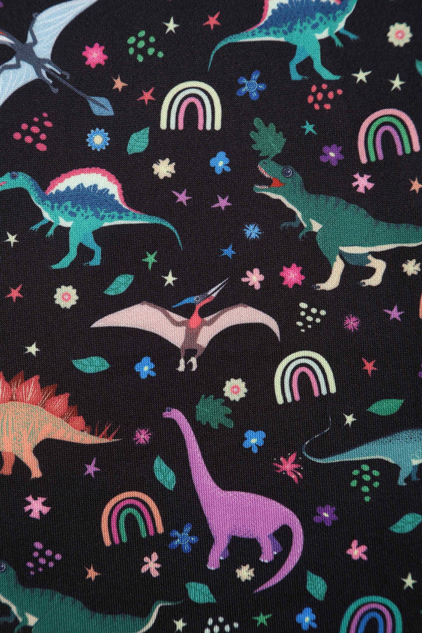 Close up view of Black Flared Dress in Dinosaur & Rainbow Print