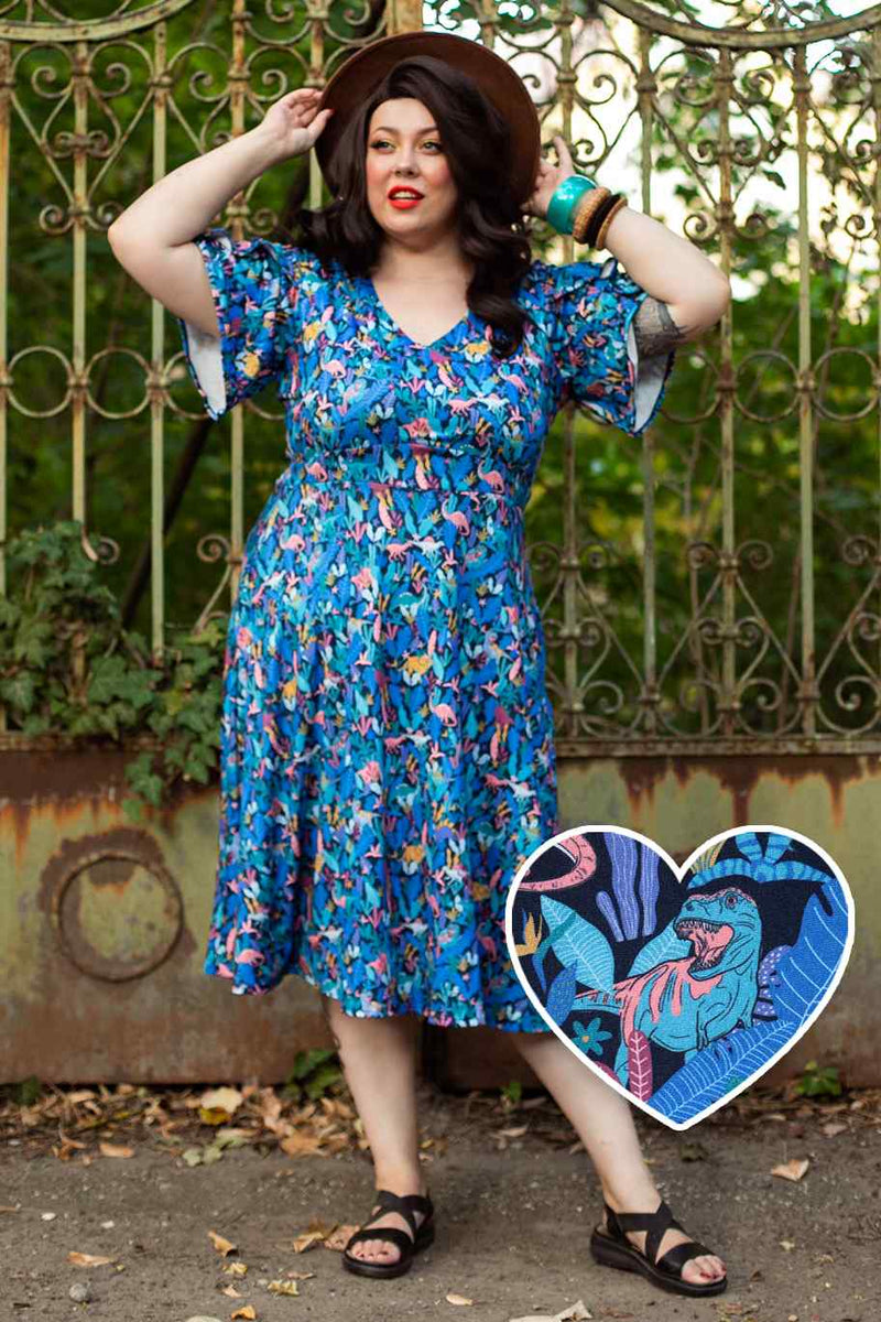 A model wearing a Dinosaur Navy Blue Petal Sleeve Tea Dress
