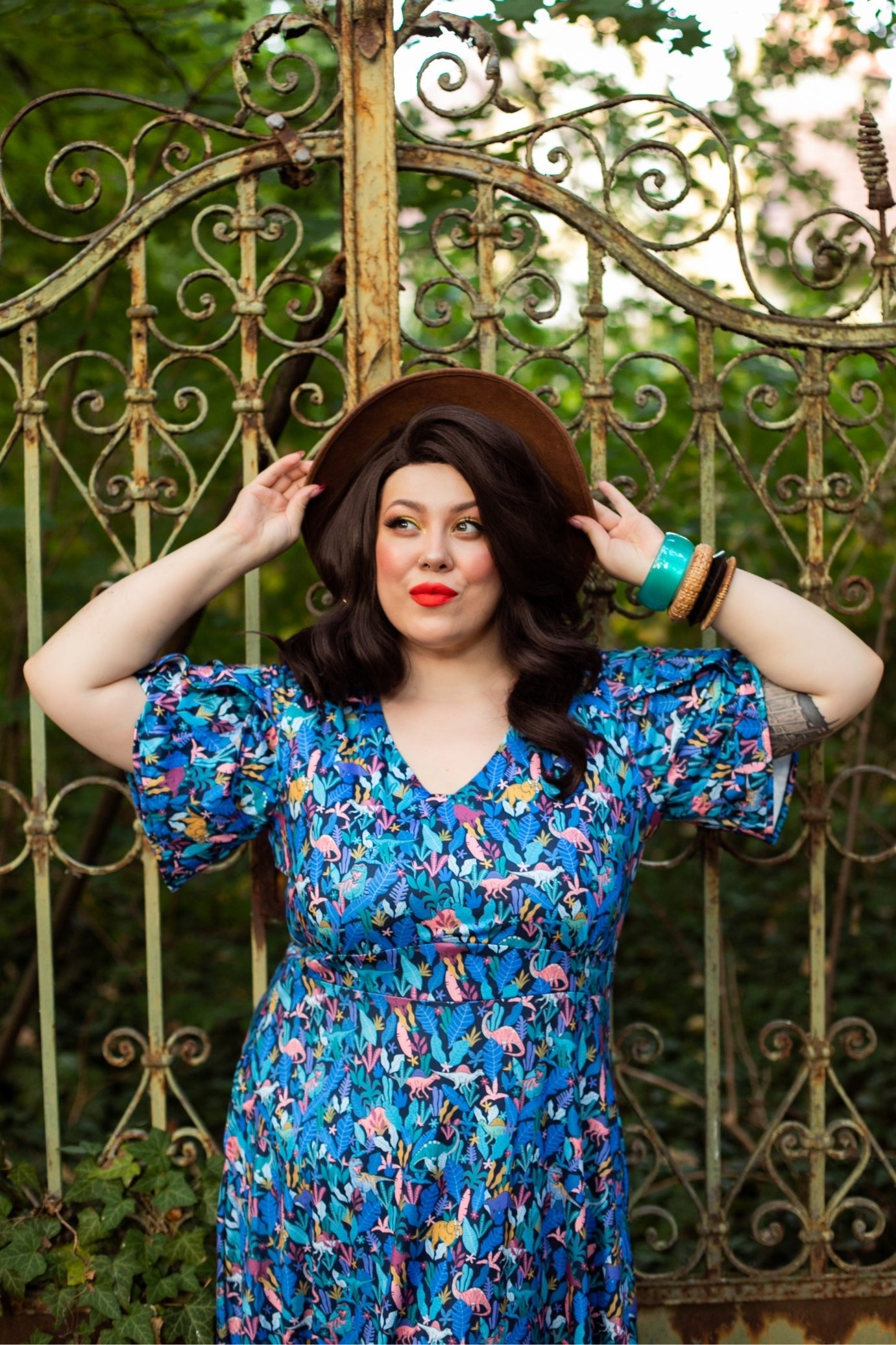 A lady wearing a Dinosaur Navy Blue Petal Sleeve Tea Dress