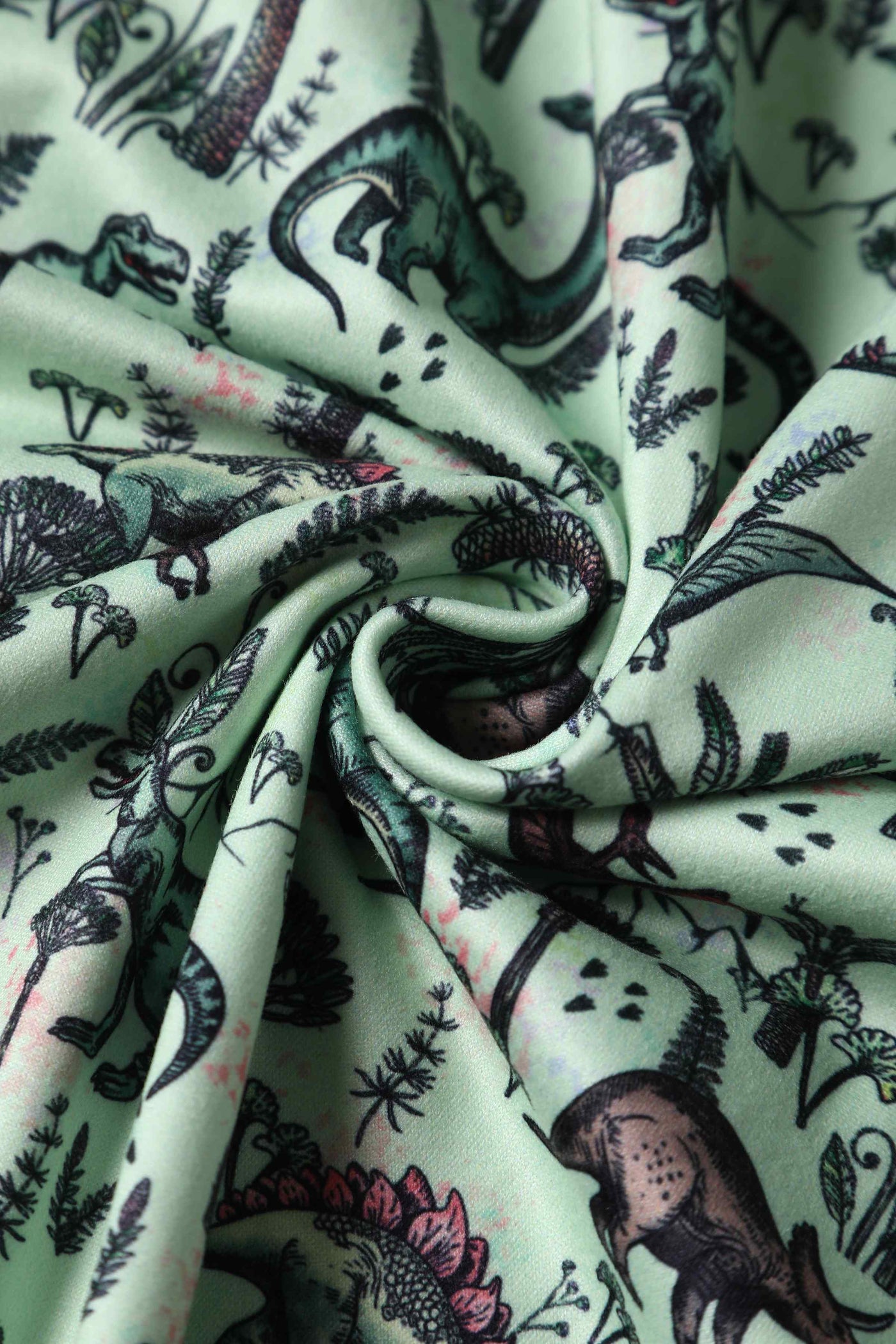 Close up view of Dinosaur Print Long-Sleeved Dress in Light Green