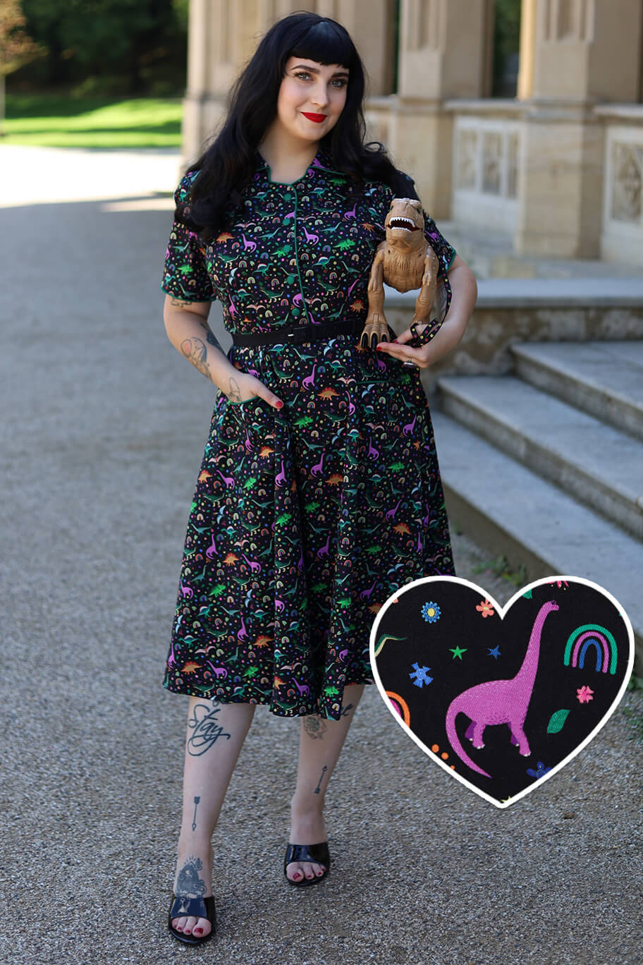 A model wearing a Mabel Dinosaur & Rainbow Midi Shirt Dress In Black