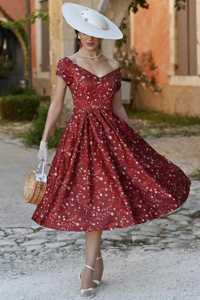 A model in Lily Ditsy Floral Off Shoulder Dress In Red