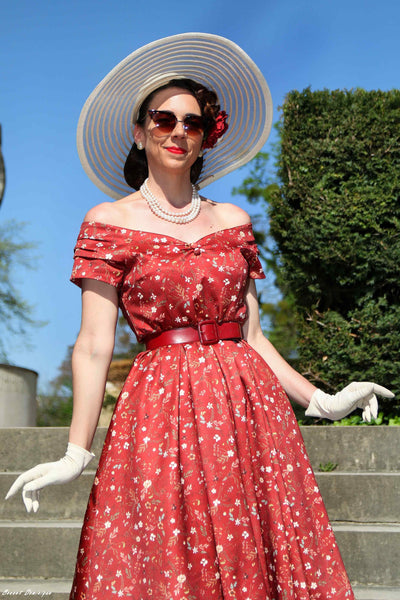 A model wearing a Ditsy Floral Off Shoulder Dress In Red