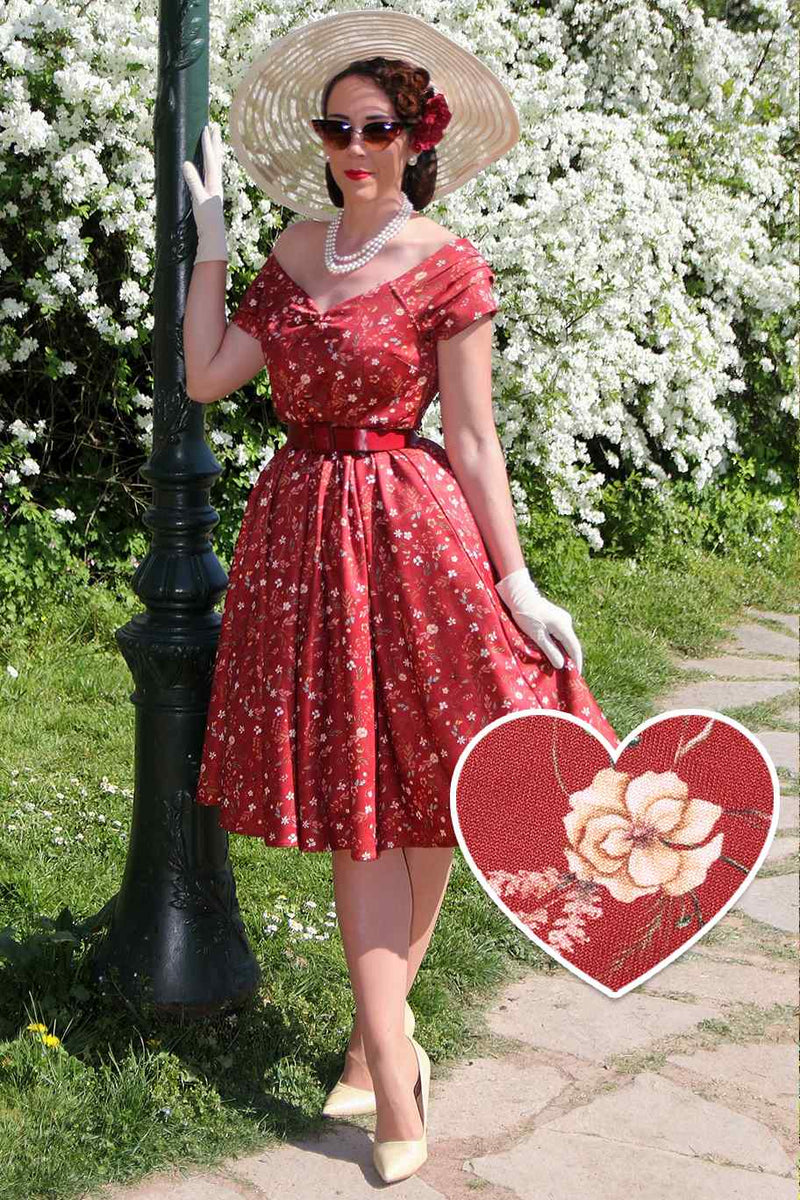 A model wearing a Ditsy Floral Off Shoulder Dress In Red