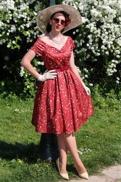 A model wearing a Ditsy Floral Off Shoulder Dress In Red