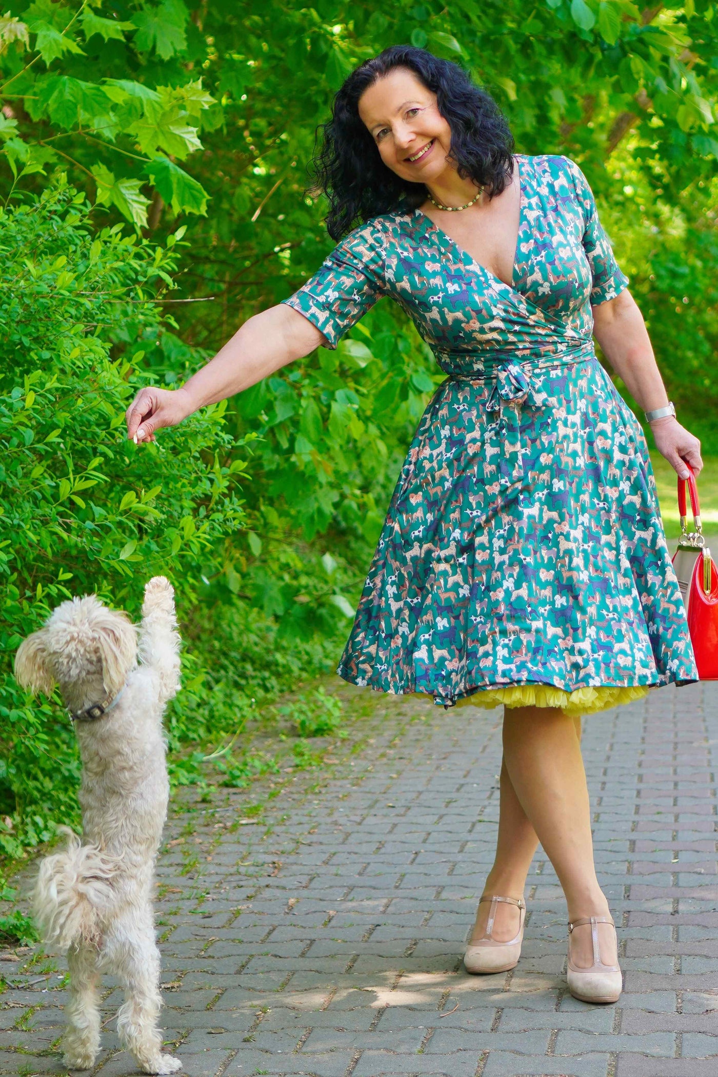 A model wearing Dog Lover Wrap Dress In Green