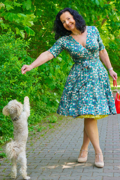 A model wearing Dog Lover Wrap Dress In Green