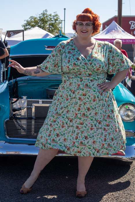 A lady wearing a Donna Green Squirrel Woodland Tea Dress