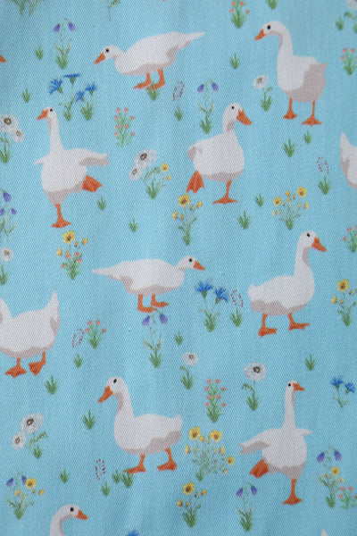 Close up view of Duck Farm Shirt Dress In Light Blue