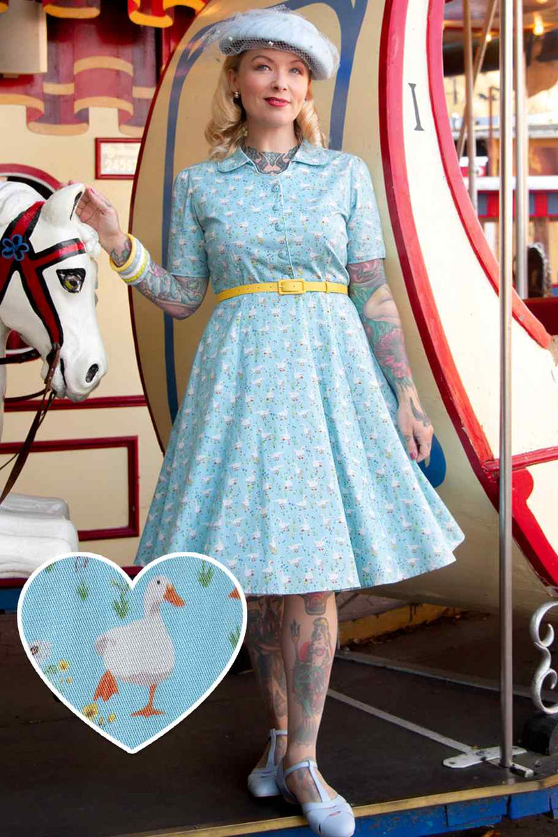A model wearing a Duck Farm Shirt Dress In Light Blue