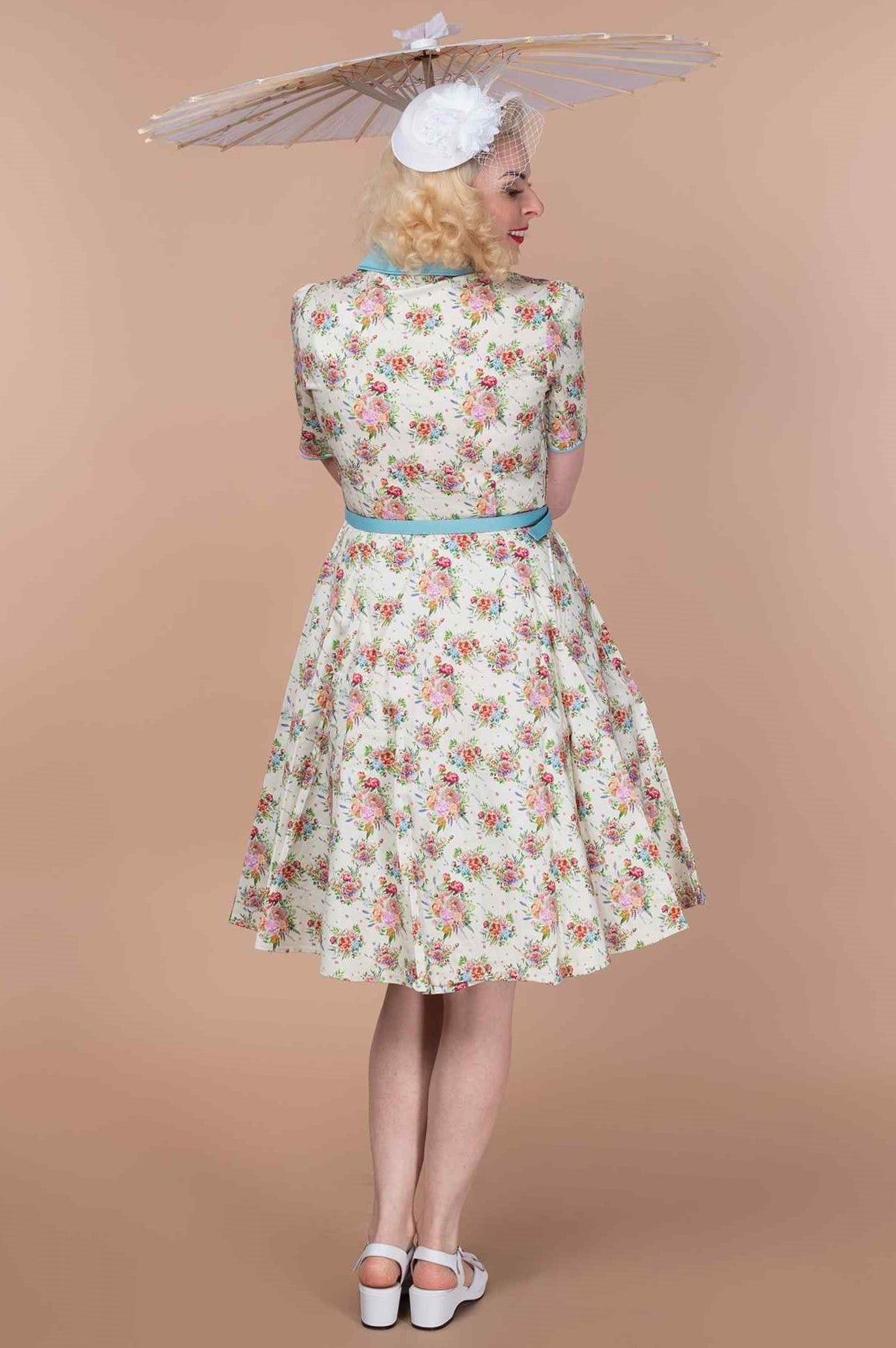 A model wearing a English Garden Shirt Dress In White