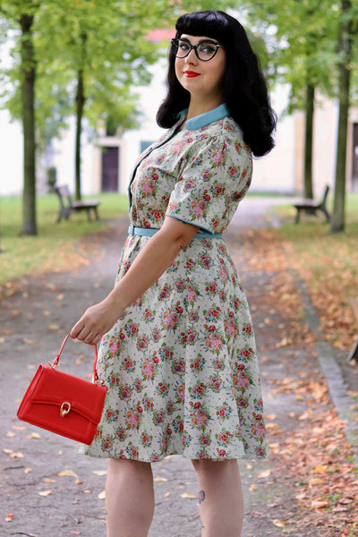 A model wearing an English Garden Shirt Dress In White