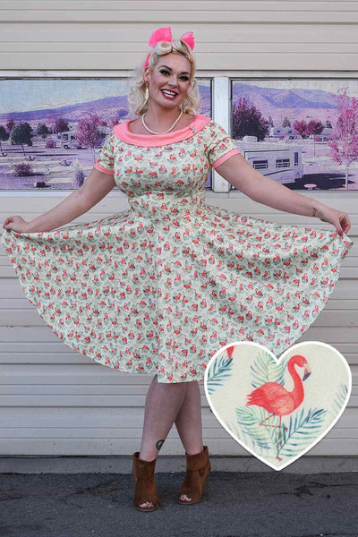 A lady wearing a Pink Flamingo Off Shoulder Dress