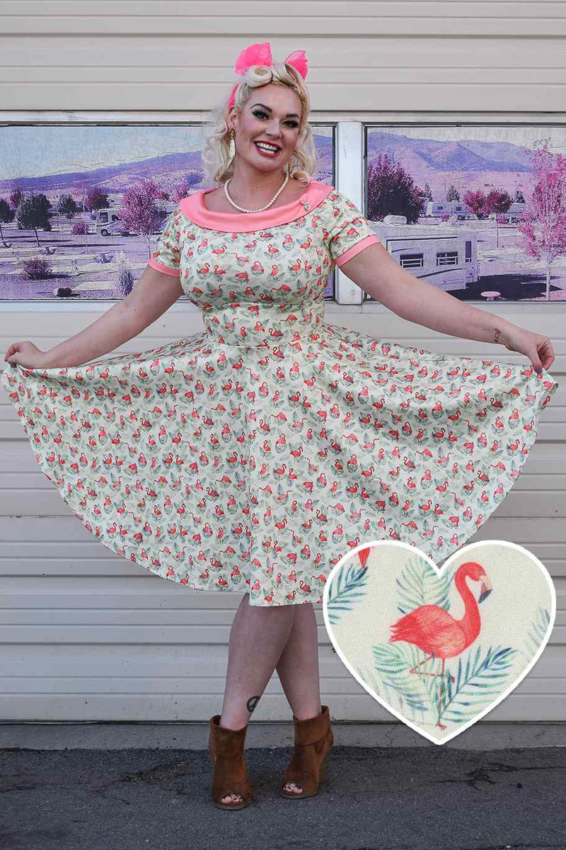 A lady wearing a Pink Flamingo Off Shoulder Dress