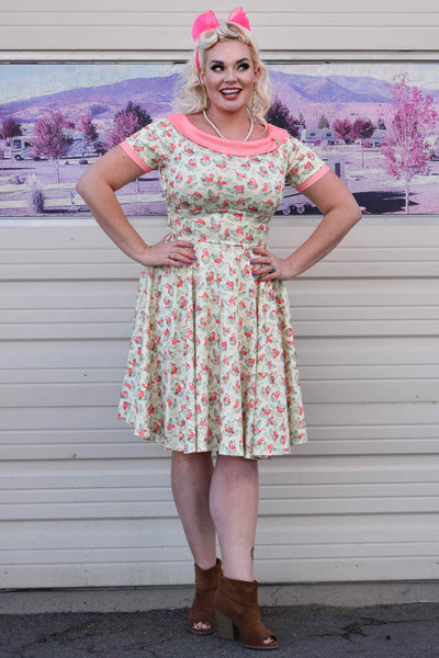 A lady wearing a Pink Flamingo Off Shoulder Dress