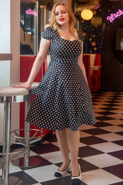 A lady wearing a Flirty Fifties Style Dress in Black