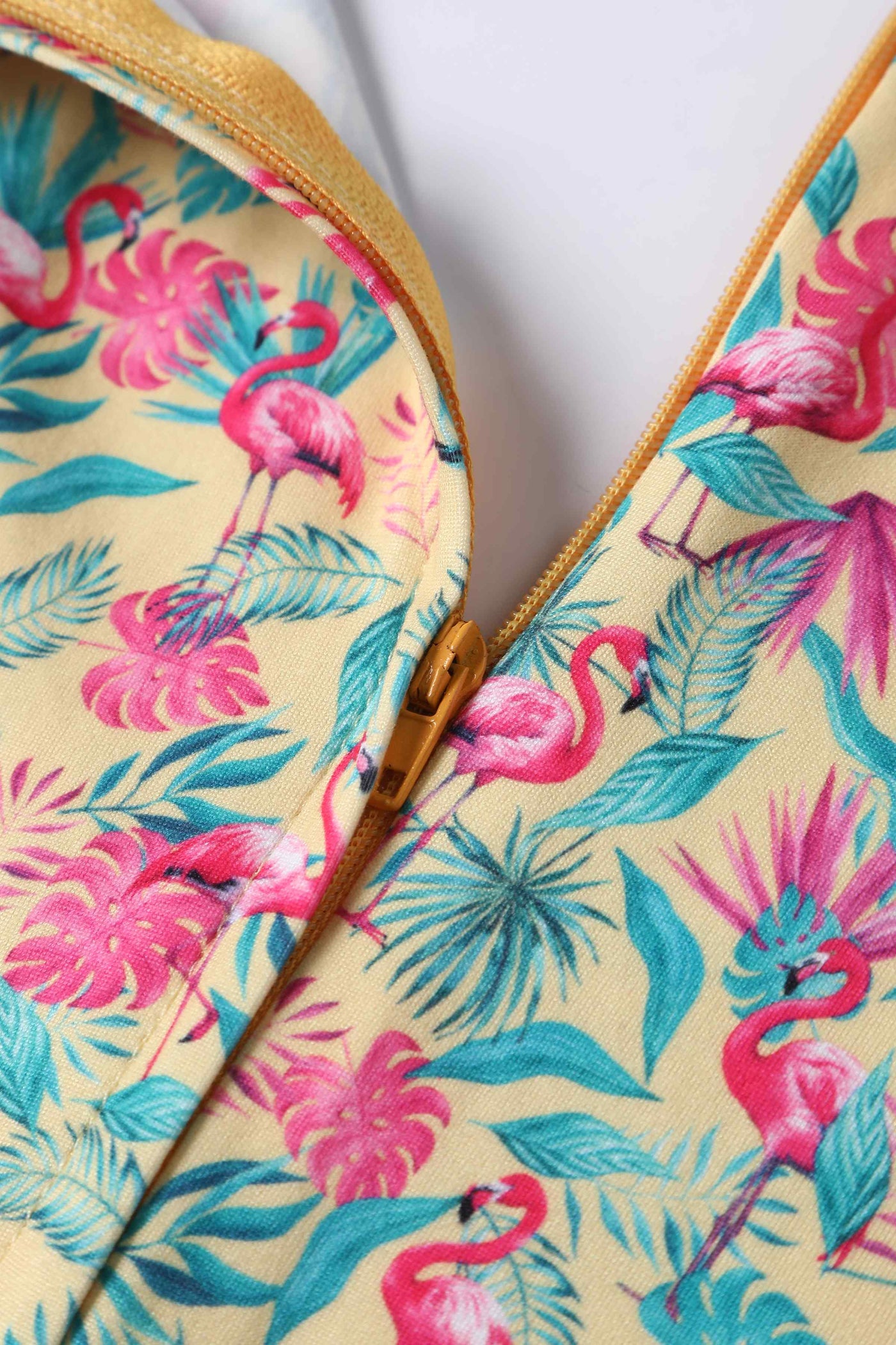 Close up view of Flock Star Flamingo Print Flared Dress in Yellow