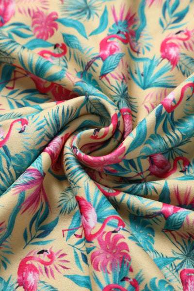 Close up view of Flock Star Flamingo Print Flared Dress in Yellow