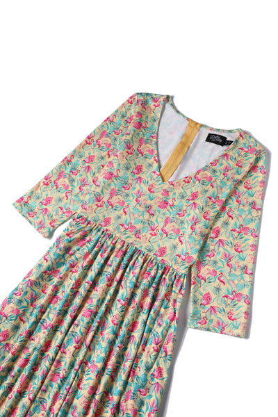 Close up view of Flock Star Flamingo Print Flared Dress in Yellow