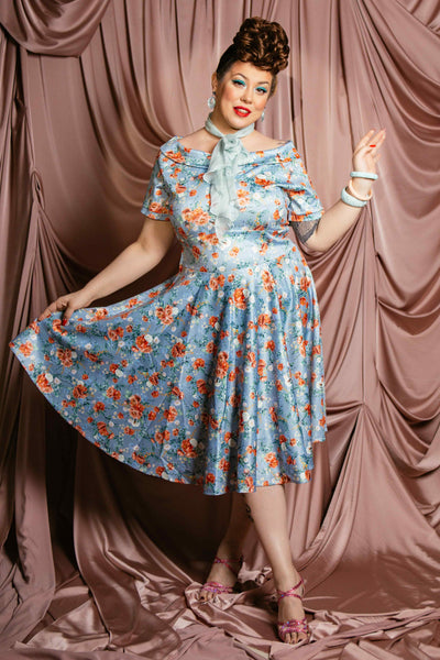 A lady wearing a Blue Floral Off Shoulder Dress