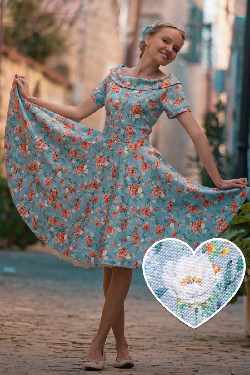 A lady wearing a Blue Floral Off Shoulder Dress