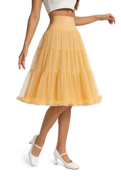 Close up view A model wearing a Fluffy Net Petticoat 25.5 In Champagne