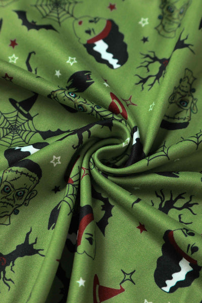Close up view of Frankenstein and The Bride Print Dress in Olive Green