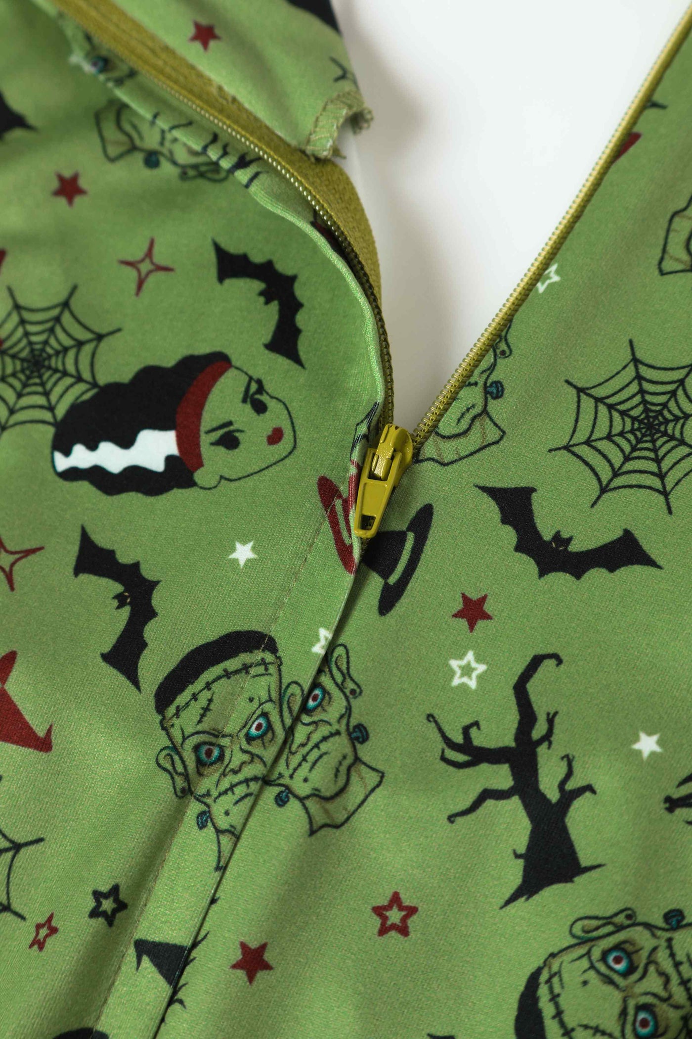 Close up view of Frankenstein and The Bride Print Dress in Olive Green
