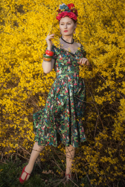 A model wearing Frida Kahlo Inspired Off Shoulder Dress