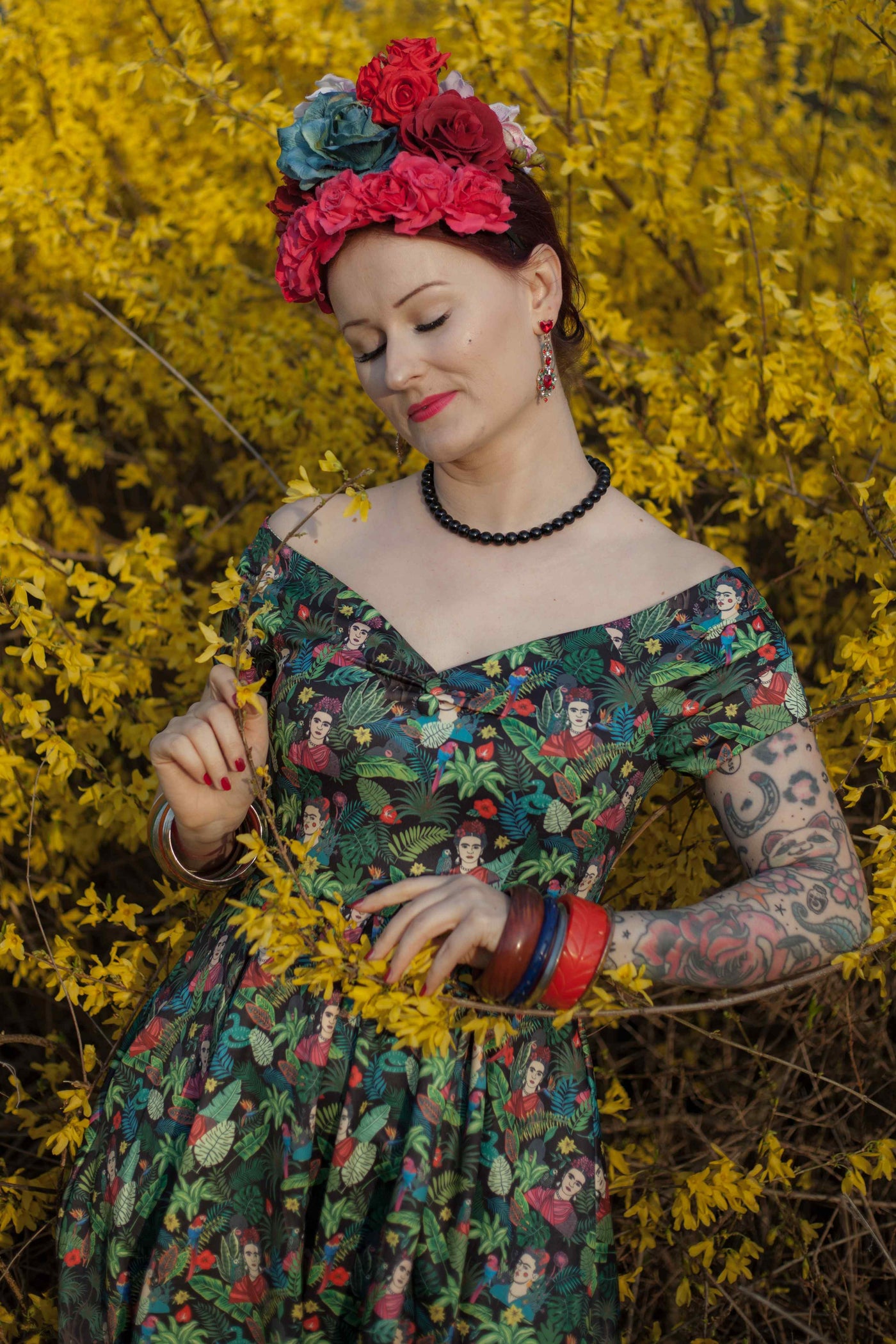 A model wearing Frida Kahlo Inspired Off Shoulder Dress